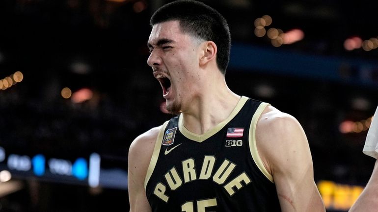 Purdue center Zach Edey celebrates after blocking a shot against...