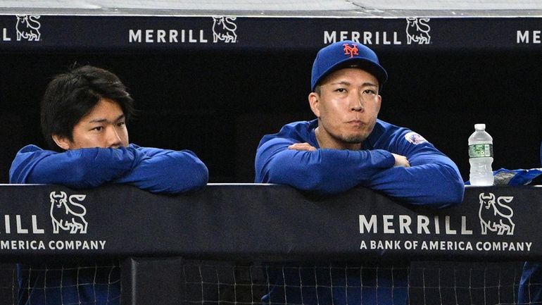 Mets pitcher Kodai Senga looks on from the dugout during...