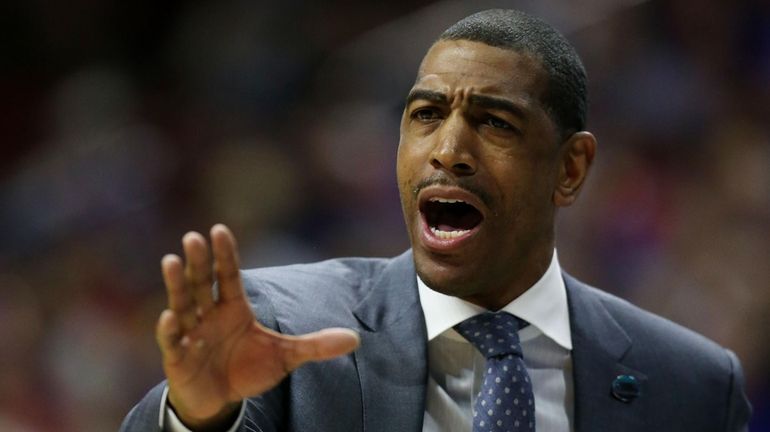 Kevin Ollie, then the head coach of Connecticut, reacts in the...