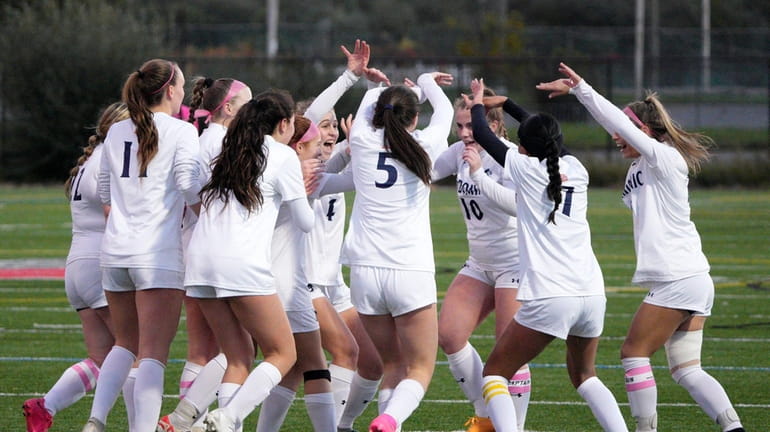 Players from St. Dominic celebrate after scoring during their CHSAA semifinal on...