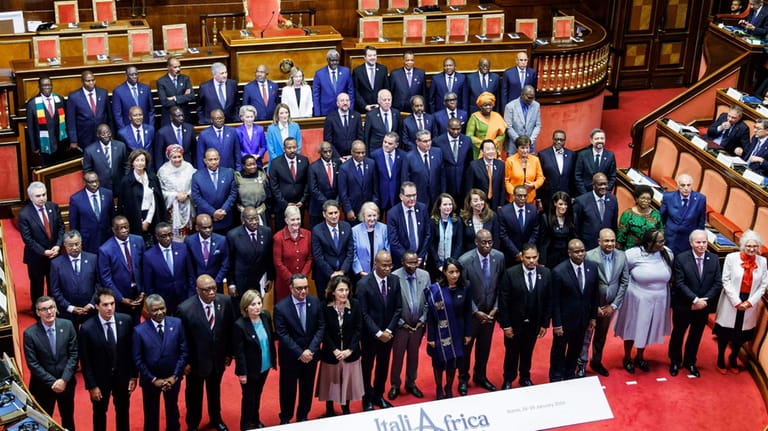 Italian Premier Giorgia Meloni, top center, poses with African leaders...