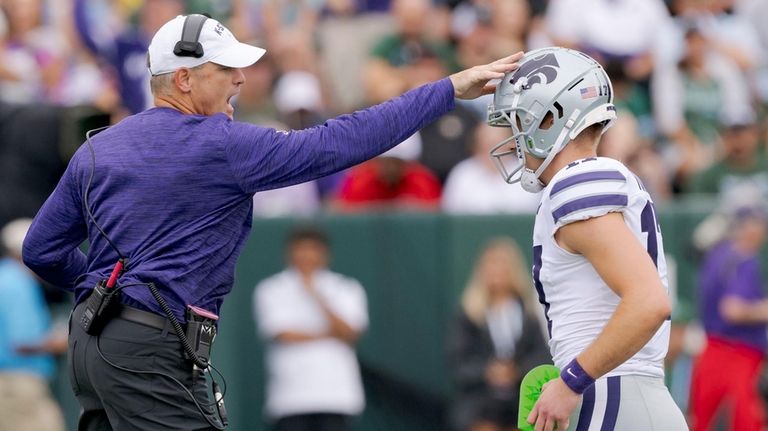 Kansas State head coach Chris Klieman celebrates a kick by...