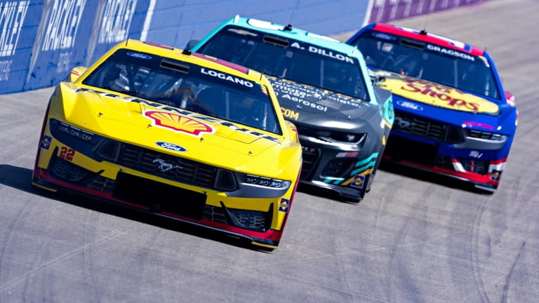 Joey Logano (22) leads Austin Dillon and Noah Gragson during...