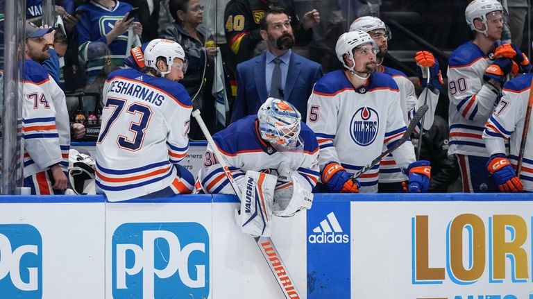 Edmonton Oilers' Stuart Skinner, Vincent Desharnais, Calvin Pickard, Cody Ceci,...