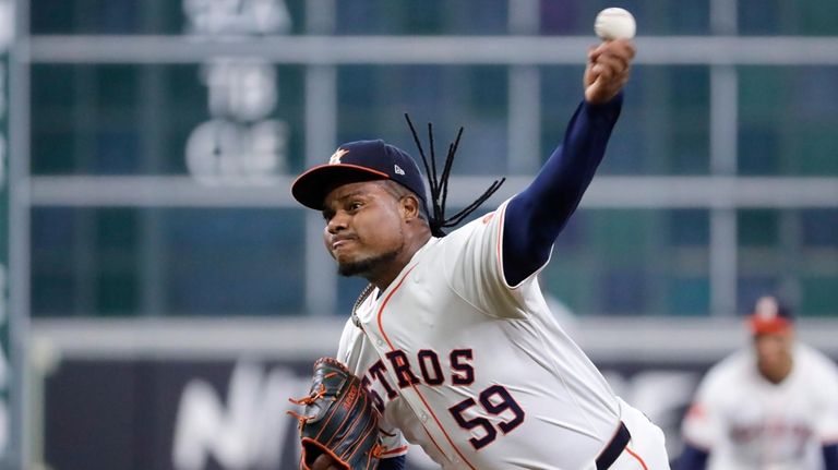 Houston Astros starting pitcher Framber Valdez throws against the Oakland...