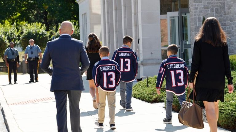 Young attendees wear Johnny Gaudreau's Columbus Blue Jackets jersey to...