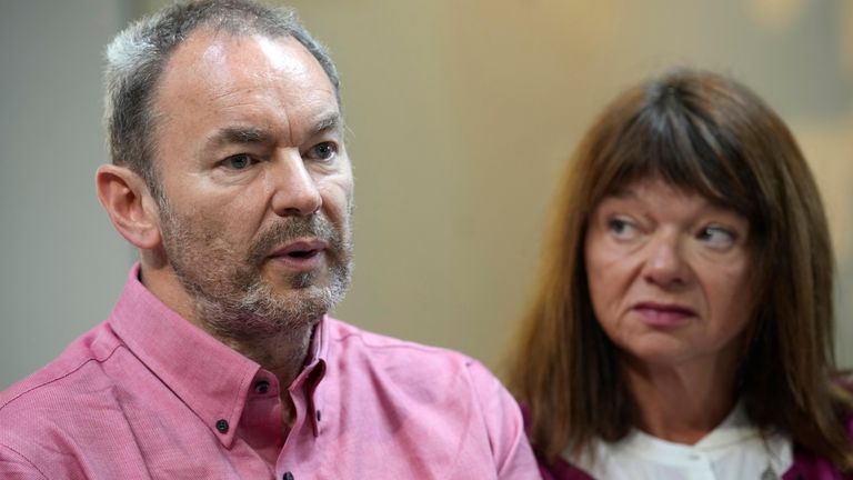 Simon Glass, left, and his wife, Sally Glass, talk about...