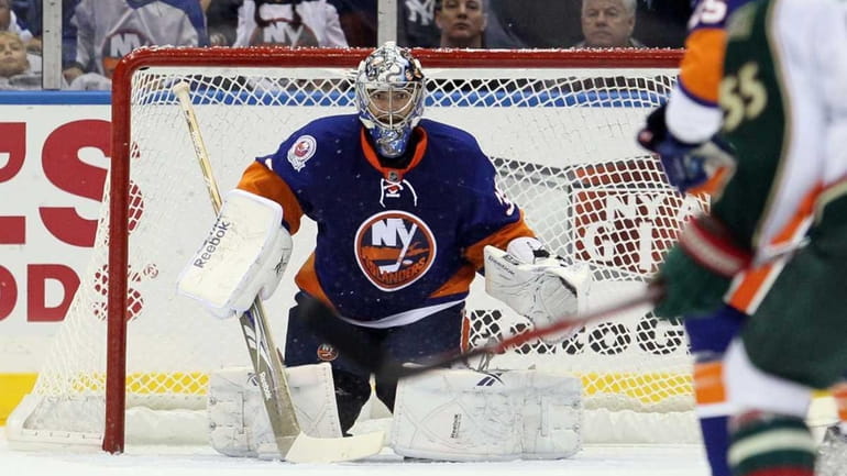 Al Montoya #35 of the New York Islanders keeps his...