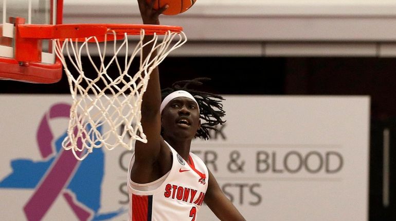 Mouhamadou Gueye #2 of the Stony Brook Seawolves goes to...