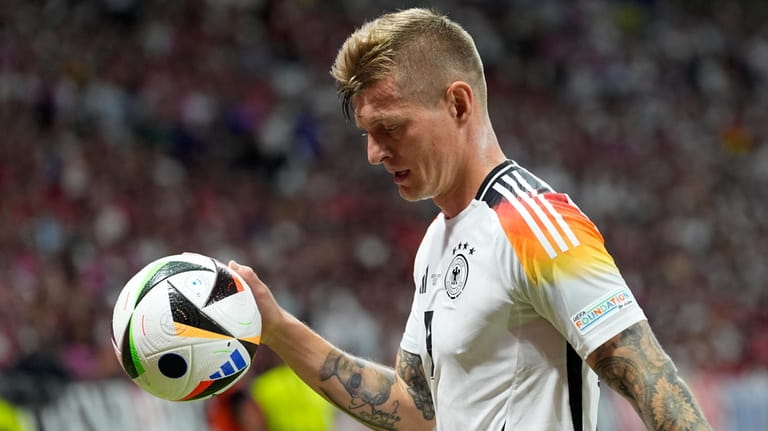 Germany's Toni Kroos takes the ball to the corner during...