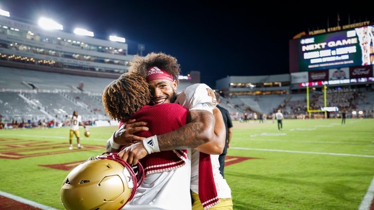 Boston College quarterback Thomas Castellanos, right, celebrates after his team...