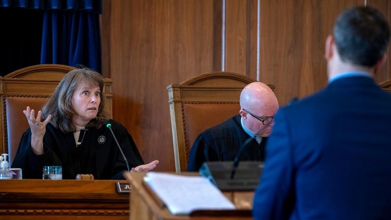 New Mexico Supreme Court Chief Justice Shannon Bacon, left, and...