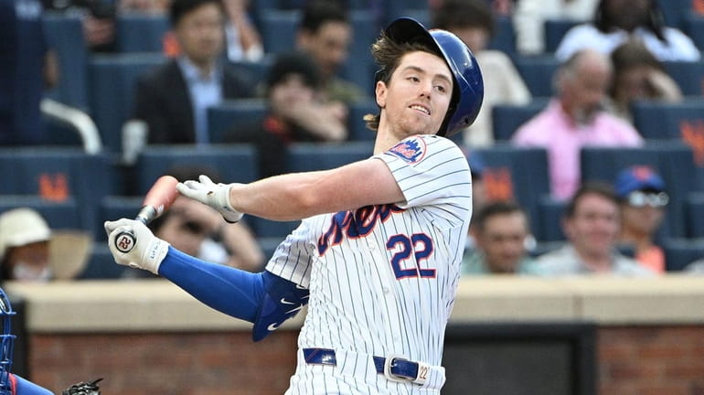 New York Mets third baseman Brett Baty strikes out against...