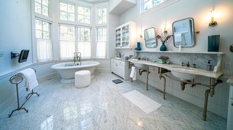 The East Hampton house's master bath has imported marble, a double-sink...