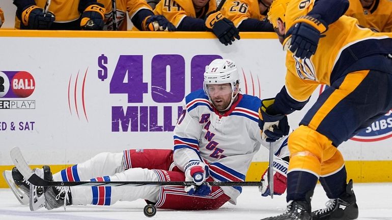 New York Rangers right wing Blake Wheeler (17) slides across...