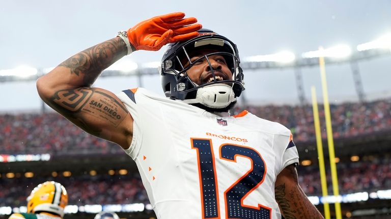 Denver Broncos wide receiver Tim Patrick celebrates after his touchdown...