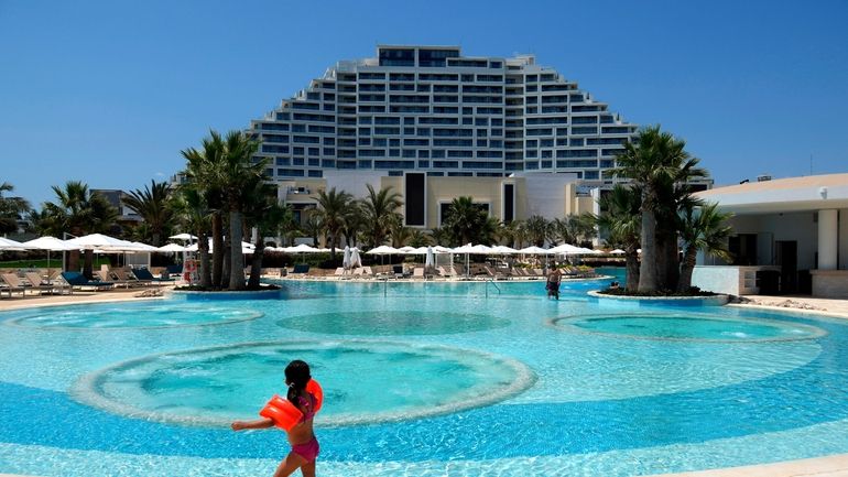 A child enjoys the pool at the City of Dreams...