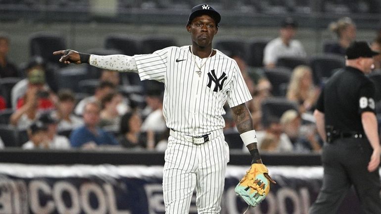 Yankees third baseman Jazz Chisholm Jr. gestures to fans before...