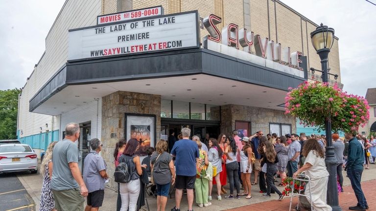 People line up for the movie’s premiere in Sayville on...