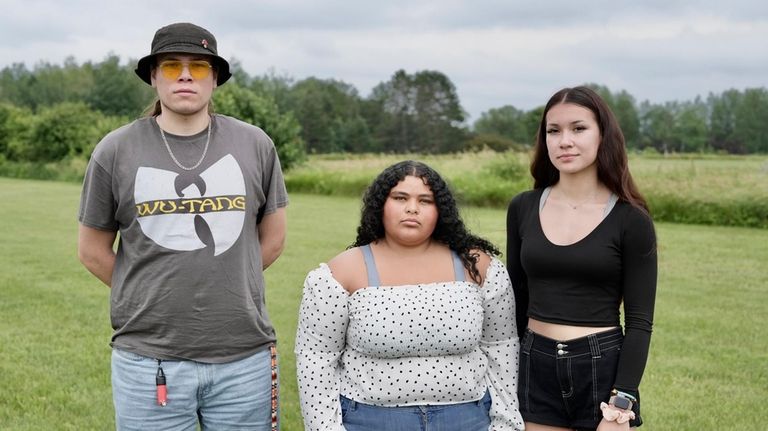 Jakob Wilson, Isabella Stensrud-Eubanks, and Kaiya Wilson pose for a...