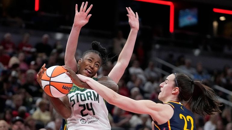 Seattle Storm's Jewell Loyd (24) has her shot blocked by...