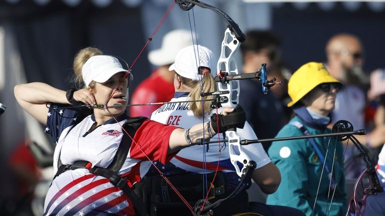 Archer Tracy Otto from the U.S. prepares to fire during...