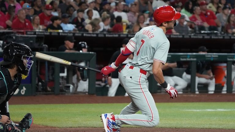 Philadelphia Phillies' Trea Turner hits a two run single against...