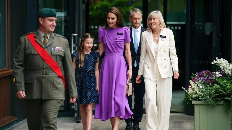 Britain's Kate, the Princess of Wales and Princess Charlotte arrive...