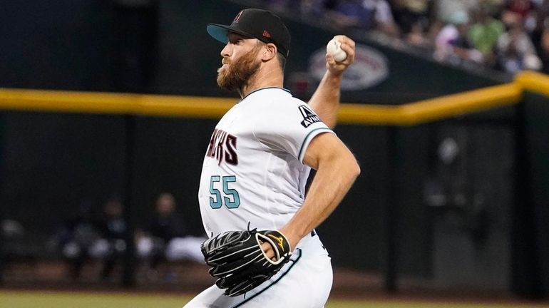 Then-Diamondbacks pitcher Austin Adams throws to a Guardians batter during...