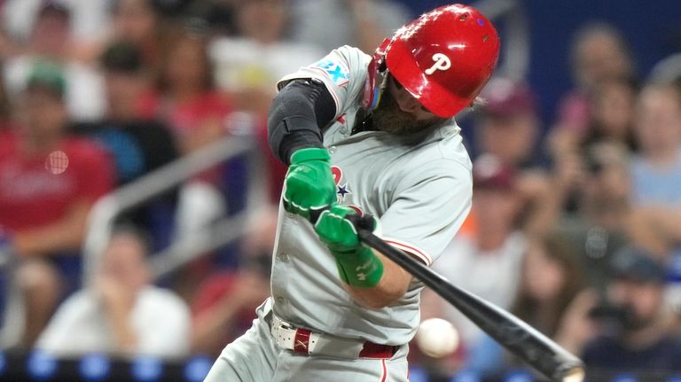 Philadelphia Phillies' Bryce Harper hits a single during the fifth...