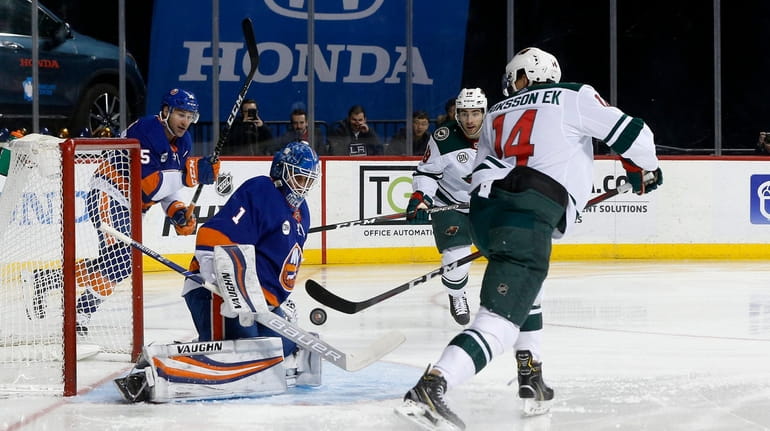Thomas Greiss of the Islanders makes a save during the...