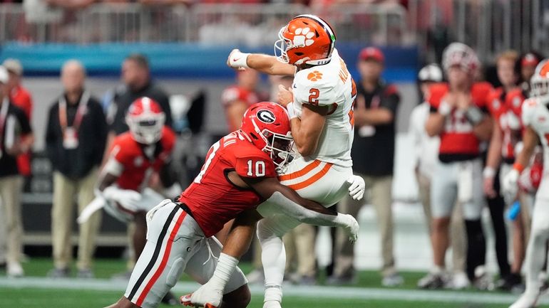 Clemson quarterback Cade Klubnik (2) is hit by Georgia linebacker...