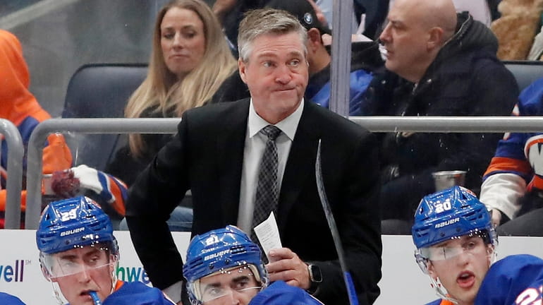 Islanders head coach Patrick Roy looks on against the Golden...