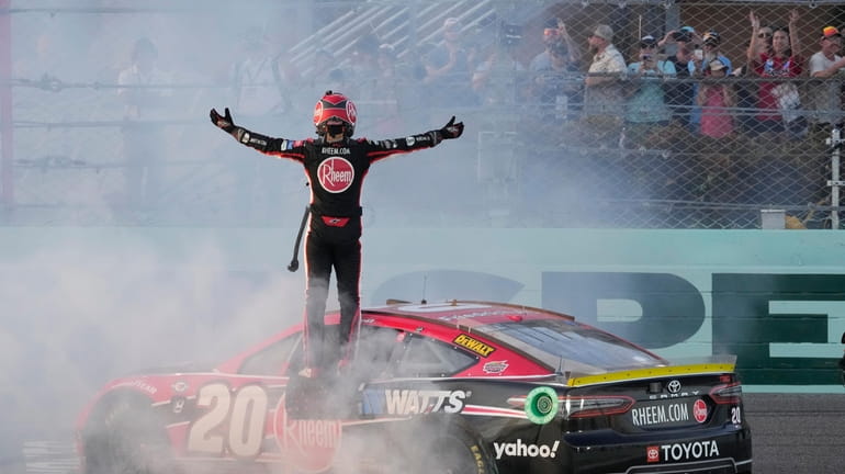 Christopher Bell (20) gets out of his car after winning...