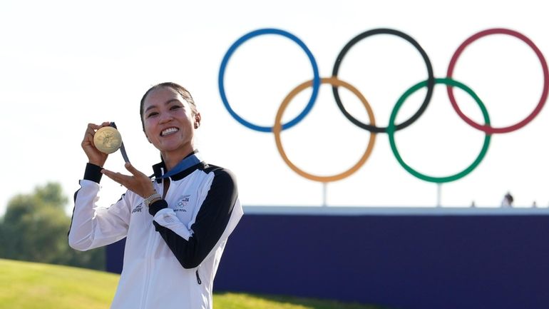 Lydia Ko, of New Zealand, poses for the cameras with...