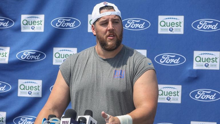 Giants guard Greg Van Roten speaks to media during training camp...