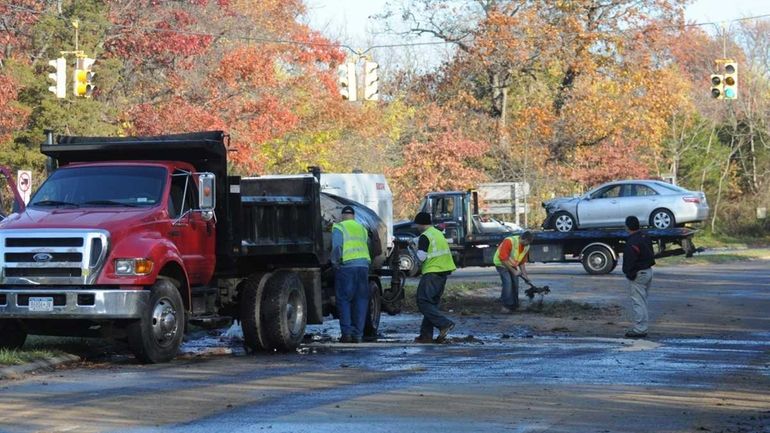 A truck towing a tanker, left, collided with a car...