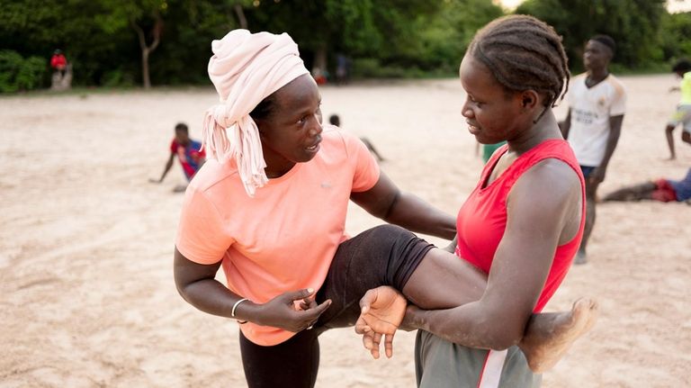 Coach Isabelle Sambou, 43 years old, two-time Olympian and nine-time...