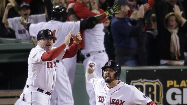 Boston Red Sox's Shane Victorino, front, celebrates his grand slam...