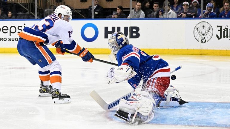 New York Islanders center Mathew Barzal scores a breakaway goal...