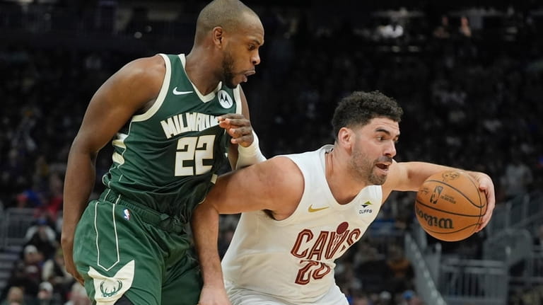 Cleveland Cavaliers' Georges Niang tries to get past Milwaukee Bucks'...
