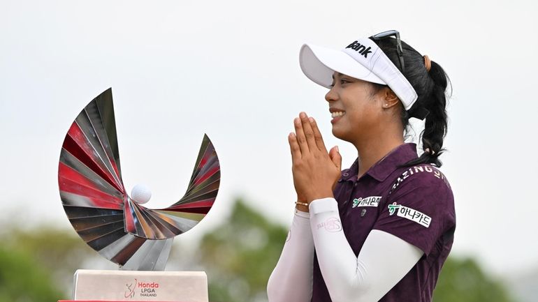 Patty Tavatanakit of Thailand reacts before a photo with her...