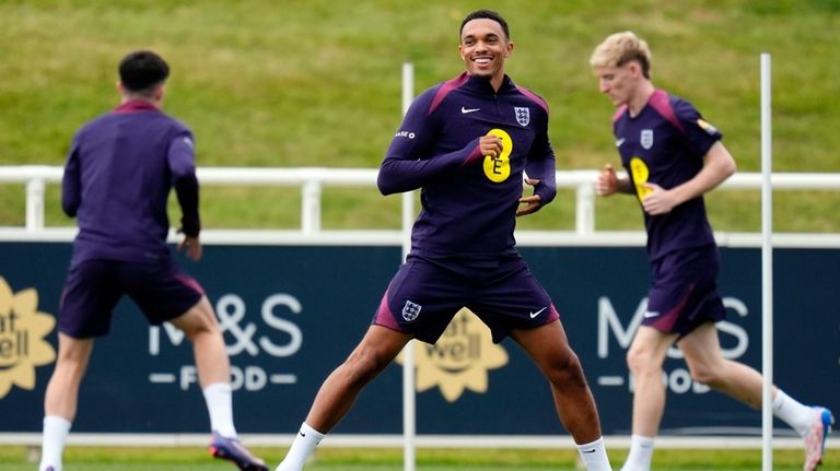 England's Trent Alexander-Arnold, front, attends a training session of England's...