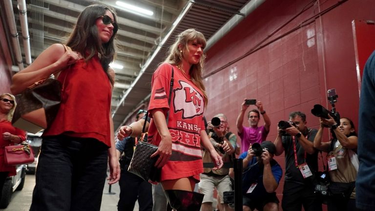 Taylor Swift arrives before the start of an NFL football...