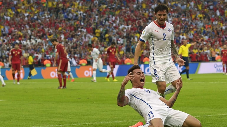 Chile's Eduardo Vargas celebrates after scoring the opening goal during...