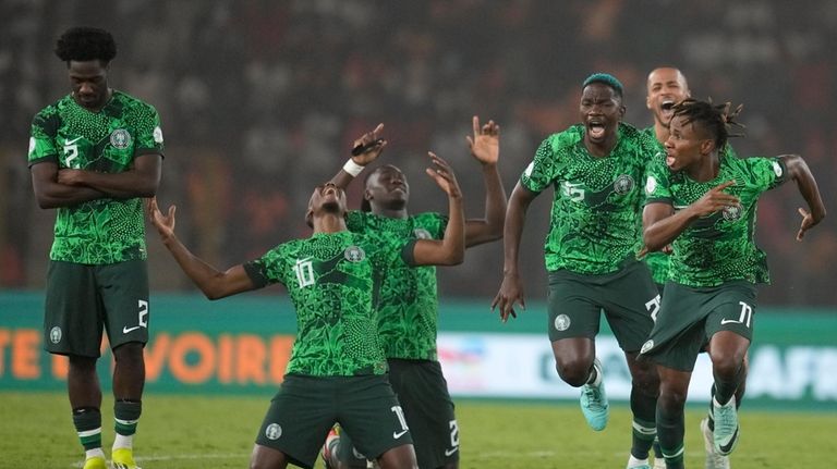 Nigeria's players celebrate winning the penalty shootout during the African...