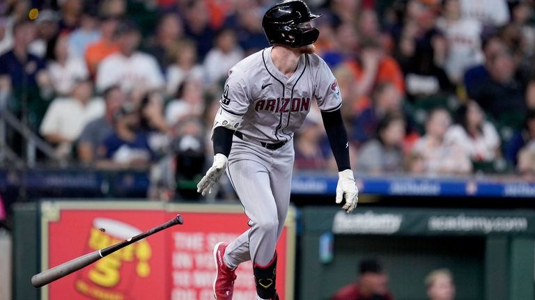 Arizona Diamondbacks' Pavin Smith watches his grand slam against the...