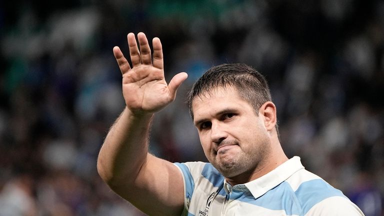 Argentina's Francisco Gomez Kodela walk around the pitch after the...