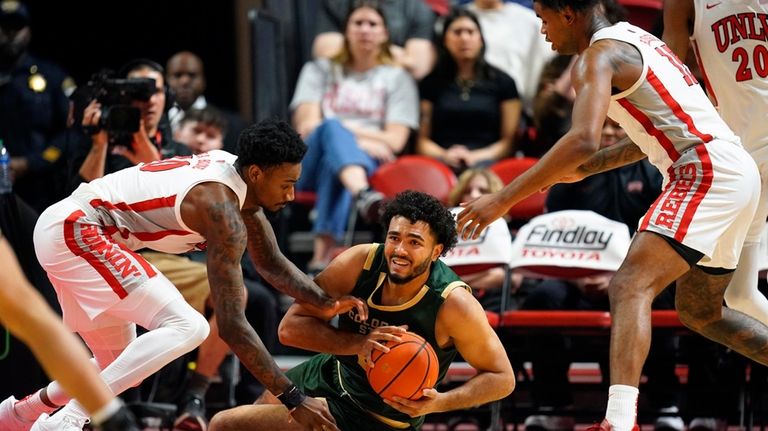 Colorado State forward Rashaan Mbemba (21) scrambles for the ball...