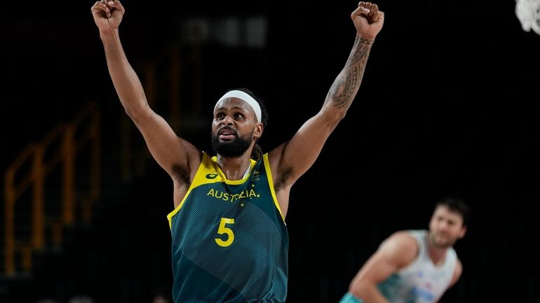 Australia's Patty Mills (5) reacts as time runs down against...